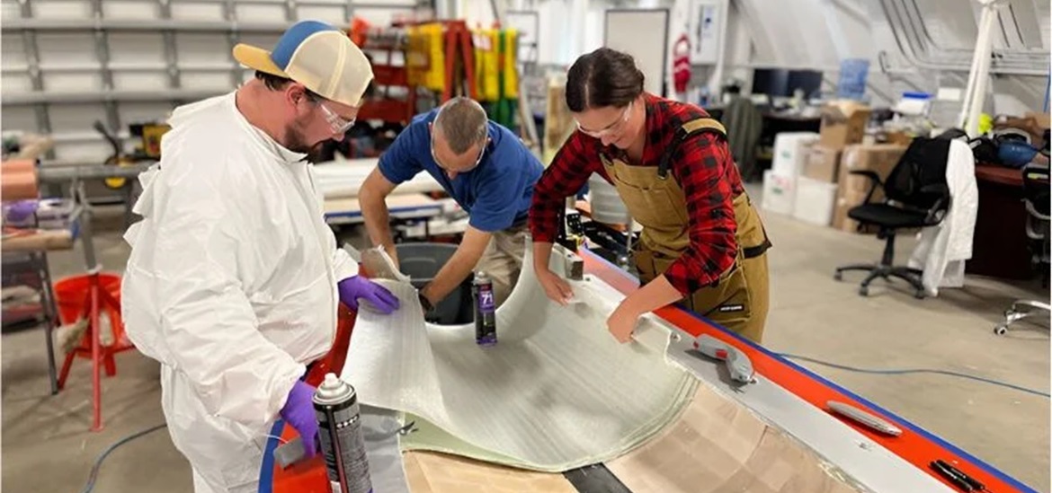 Research team working with the bamboo-based material inside a factory 