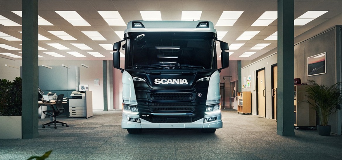 Scania truck facing the camera, in the garage
