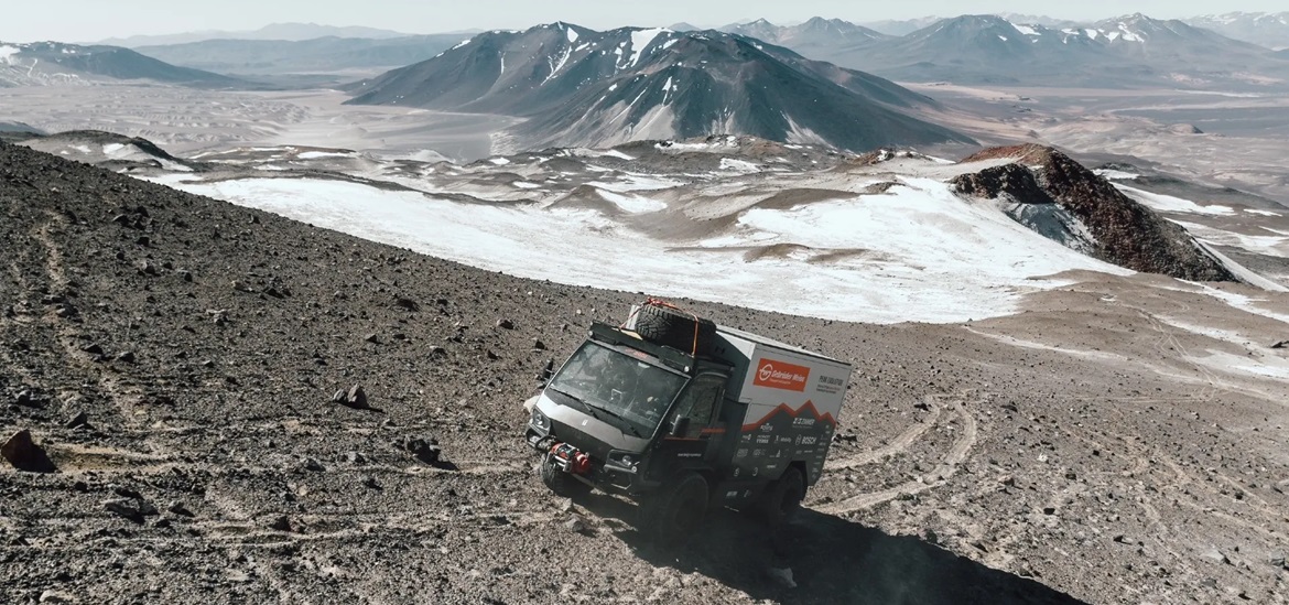  Solar Truck offroad in front of the volcano Ojos del Salado-