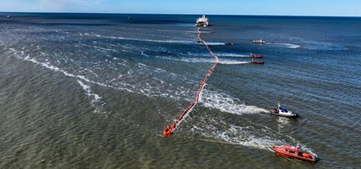installation of Viking link with a few ships- an orange cable acros the sea