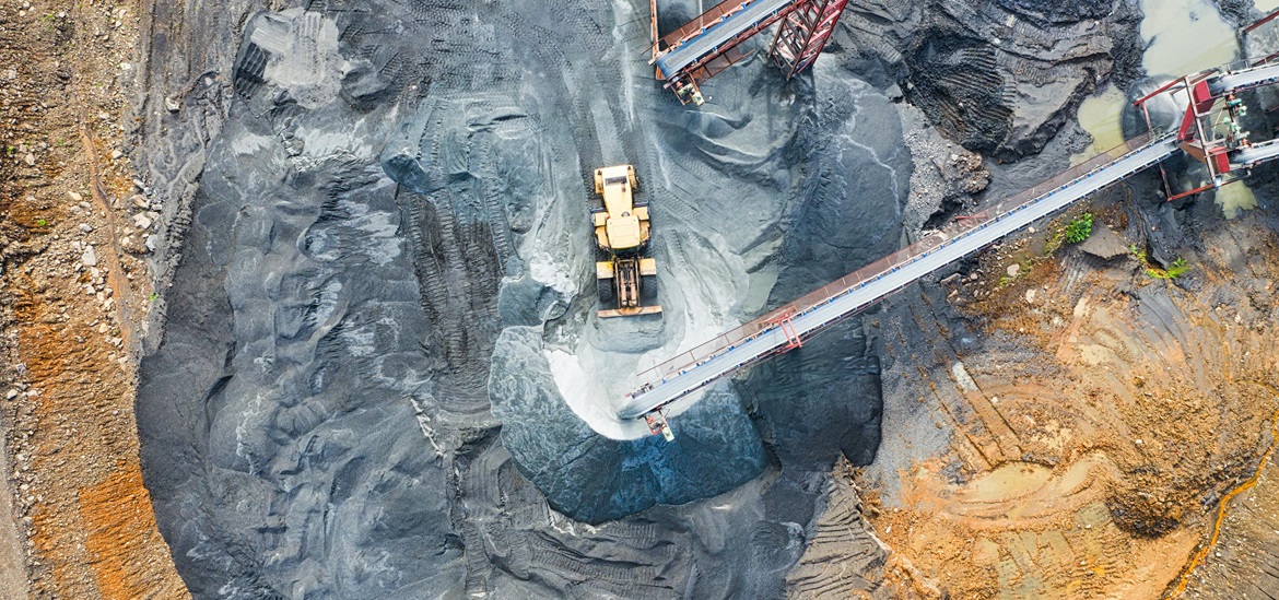 Mining site, yellow excavator- taken from air