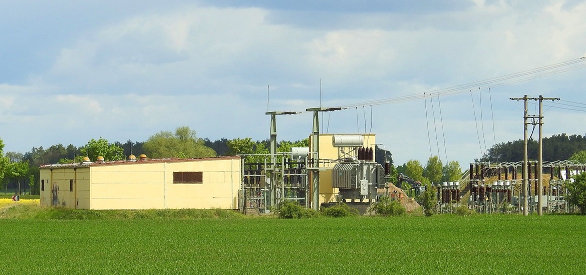 Transformer station on the green meadow