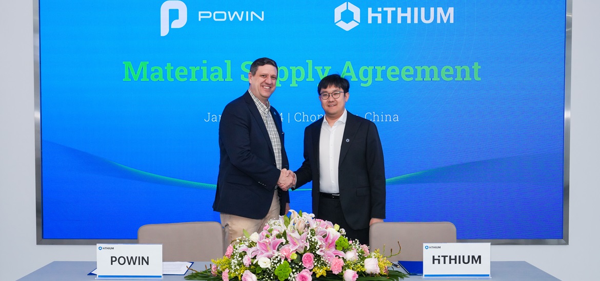Powin and Hithium representatives shaking hands for the press