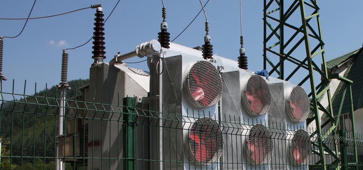 Part of a power transformer connected to the grid, protected with fence