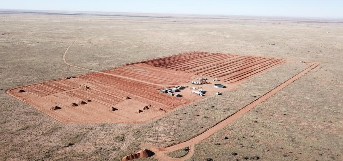 construction site of solar-plus-storage project from the air