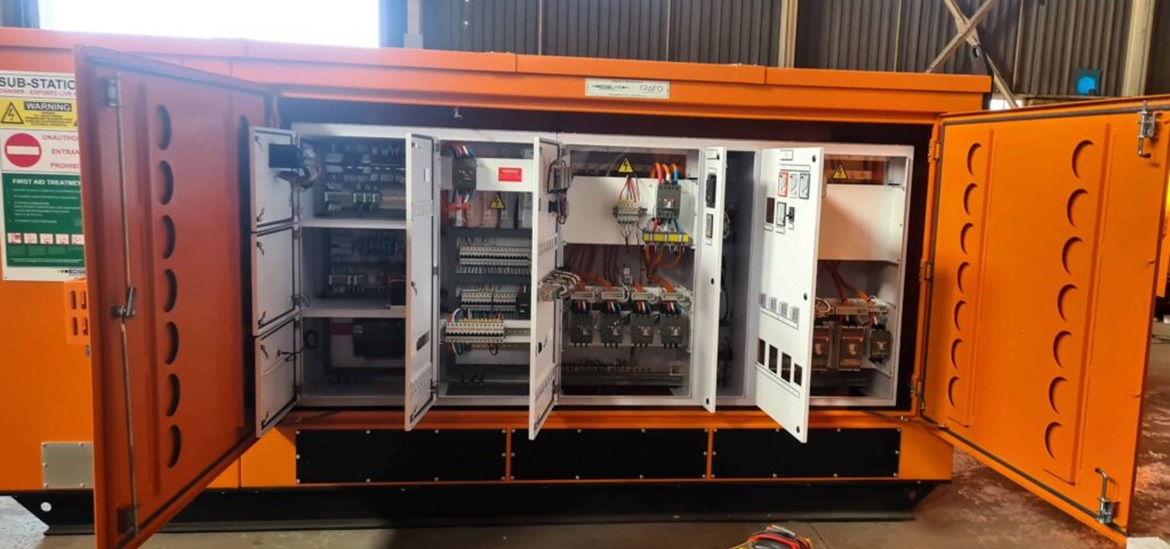 an orange container- looking transformer opend to display the inside instalations 