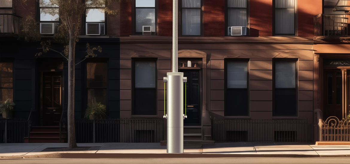 A graphic image of a street curb with a Voltpost Lamppost and a red building in the back 