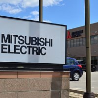 Main enterance to Mitsubisci Electric factory with their logo on